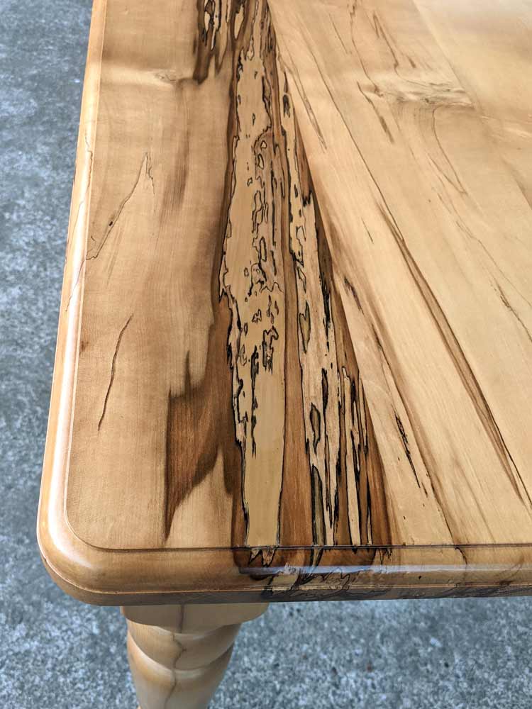 This Black Heart Sassafras dining table was stripped and sanded, and a large area of rot was treated and filled, befere a polyurethane finish was applied.