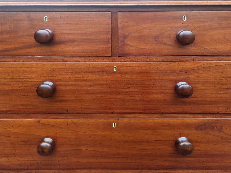 This chest of drawers was stripped and refinished, and the drawers were repaired