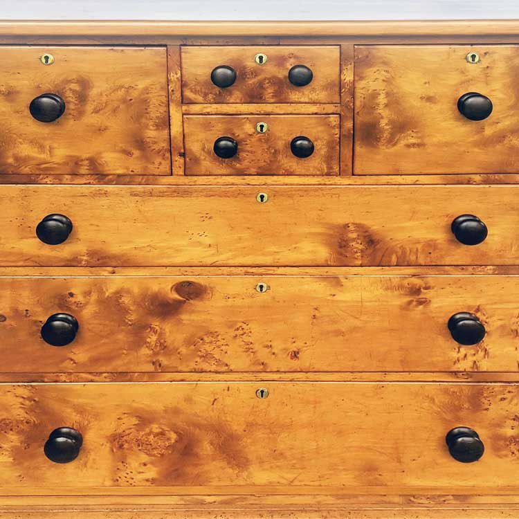 This chest of drawers was stripped and French polished, the drawers were repaired, and missing parts were reproduced