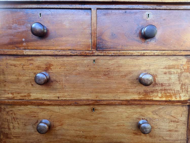 This cedar chest of drawers was sun-faded and stained, the finish had perished, and the drawers were stiff