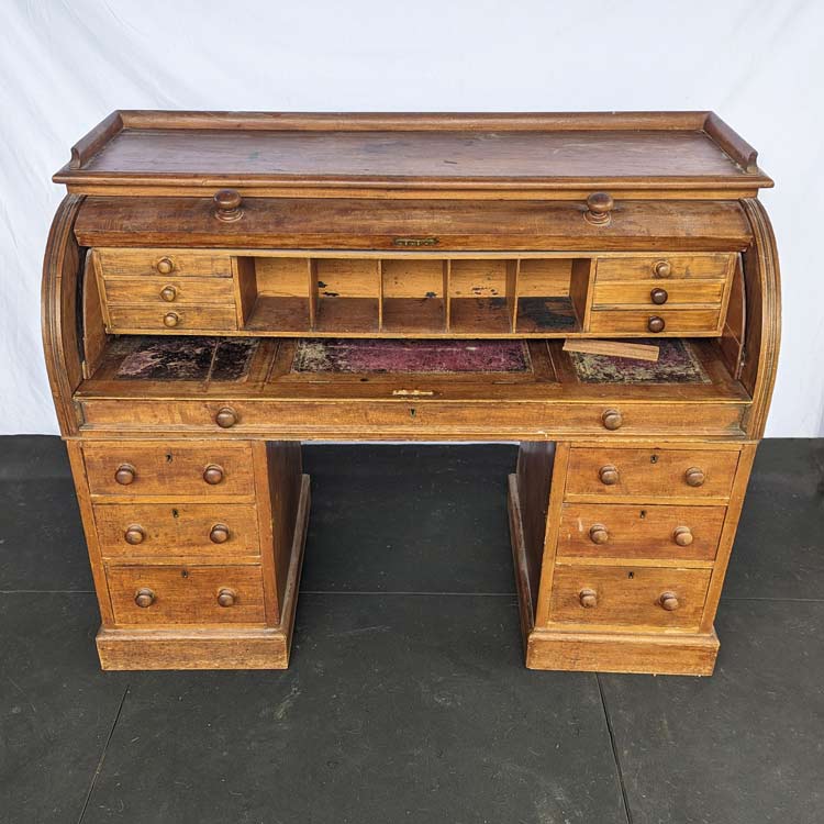 This desk was badly damaged and in need of refinishing.