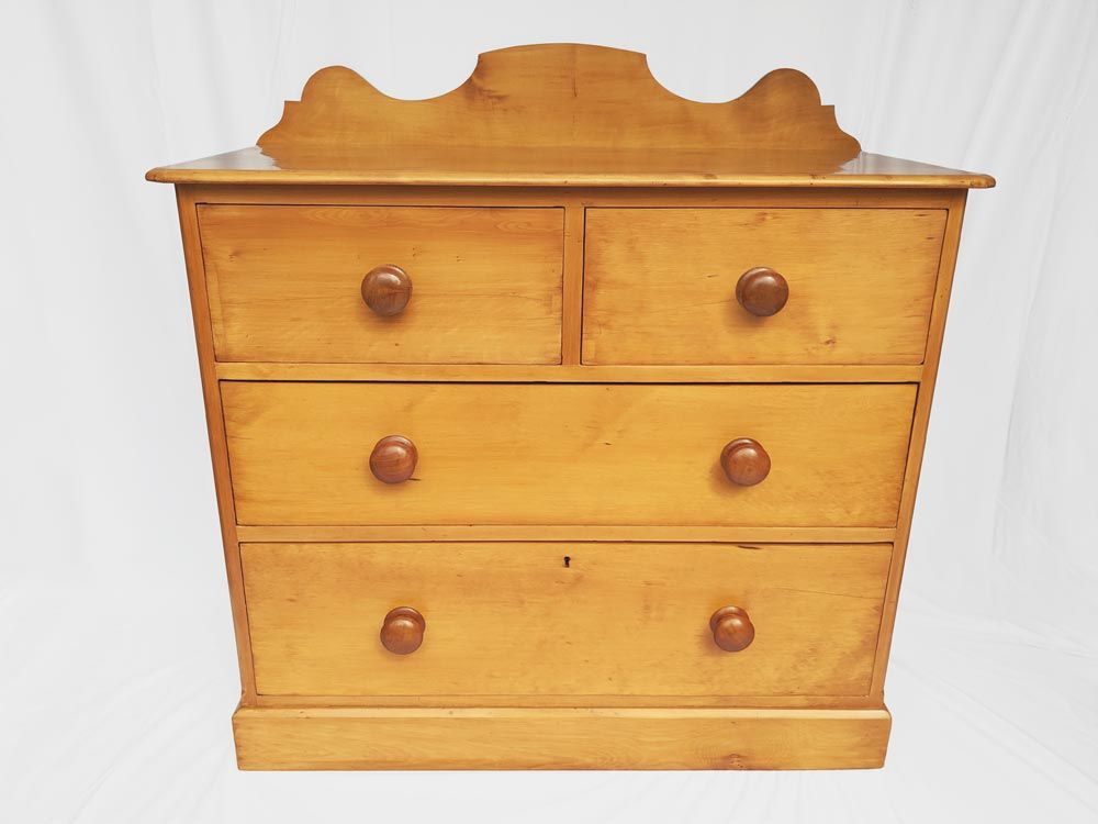 The paint was removed, missing wood was replaced, and the chest of drawers was French polished.
