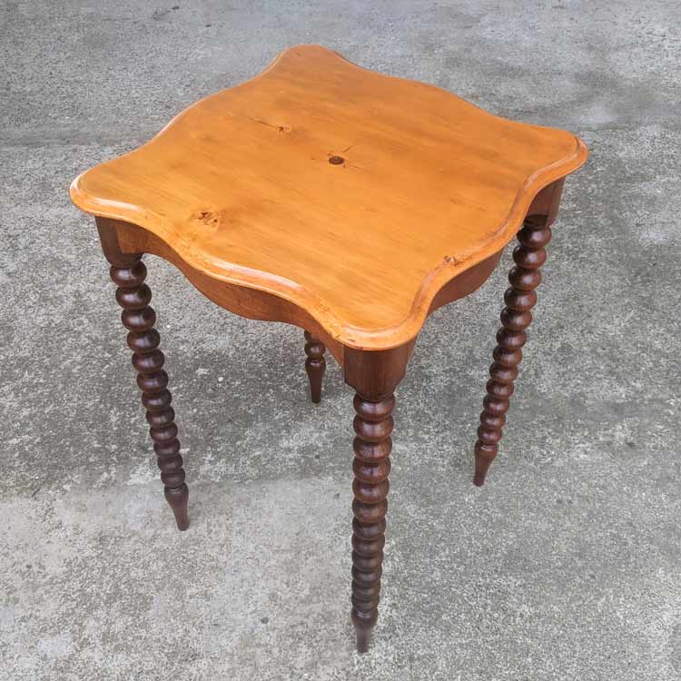 This table was stripped, the stains were removed from the top, and then French polished